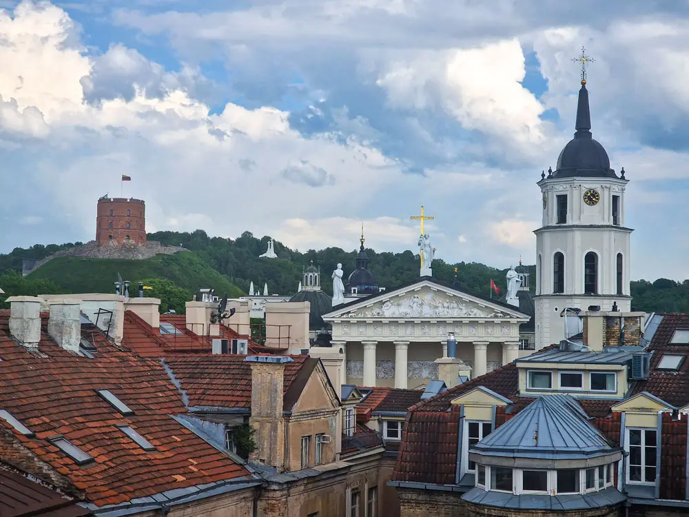 5 best cities in Europe for a first-time traveller 1 Panoramic view of Vilnius showing the Cathedral, bell tower, Gediminas Castle, and the Hill of Three Crosses.