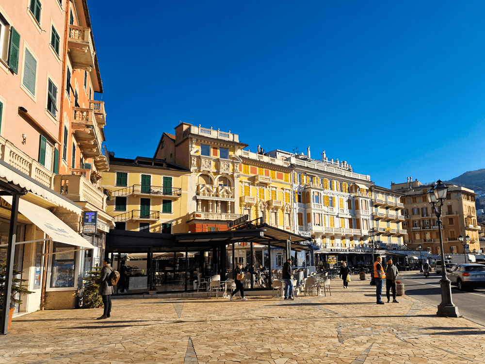 4 days in Liguria: an easy coastal trip 2 Rapallo’s waterfront with pastel houses, a café terrace and a few people walking along the promenade in early March.